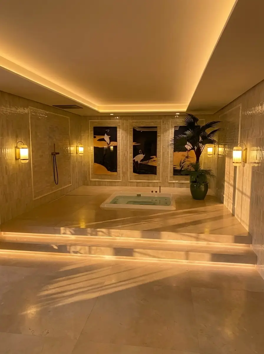 Spa pool with warm cove lighting in the villa basement