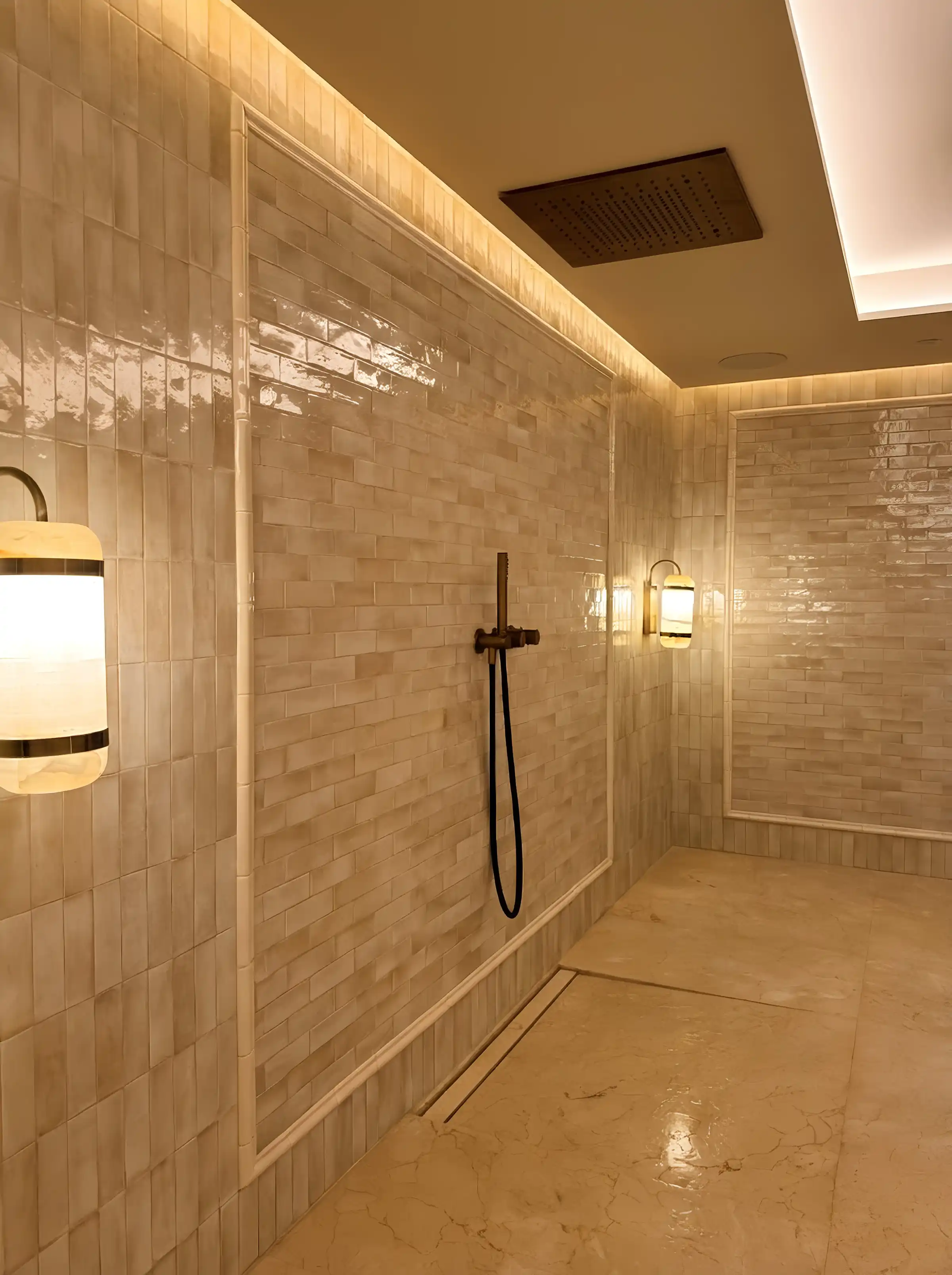 Marble-lined steam shower with brass fittings